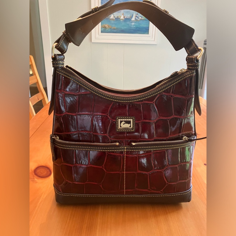 Dooney and Bourke authentic Bordeaux Denison leather purse, excellent condition